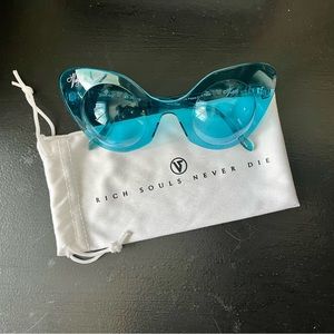 Vulgati blue tinted “Glenn Ivy” cateye sunglasses